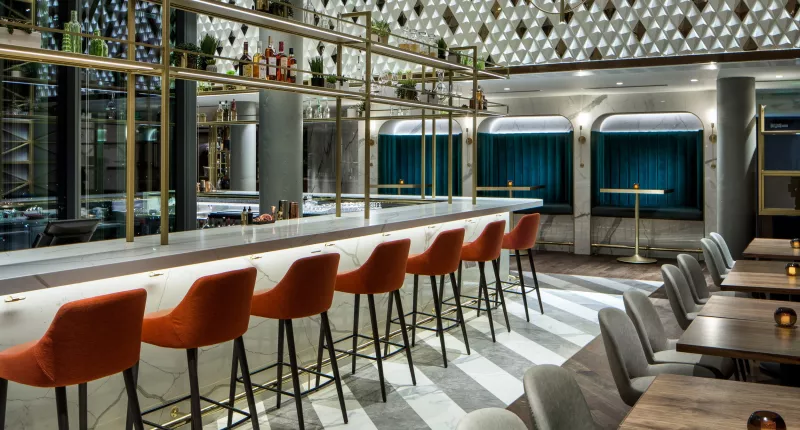 Amway Grand_MDRD_Bar_Empty_Stools_Tables_Chairs_Alcohol Rack_Window
