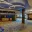 Amway Grand_West Concourse Registration_Event Space_Check In Area_One Pillar_Chairs_Tables_Two Seating Areas_Mirrors_Window_Plants