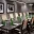 Amway Grand_Fine Arts Room_Meeting Room_Set Up_Long Table_Chairs_Notepads_Pens_Water Bottles_Paintings_TV_Flowers
