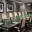 Amway Grand_Fine Arts Room_Meeting Room_Set Up_Long Table_Chairs_Notepads_Pens_Water Bottles_Paintings_TV_Flowers