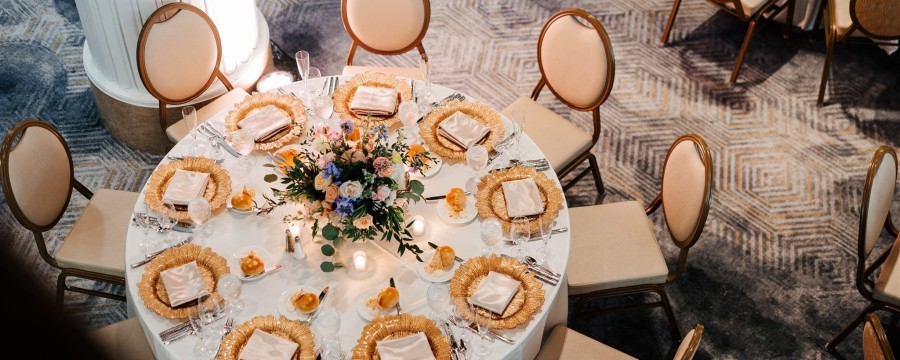 Amway Grand_Imperial Ballroom_Wedding Table Set Up_Chairs_Linen_Flowers_Candles_Plates_Napkins_Menus_Silverware_Glasses with Water_Rolls