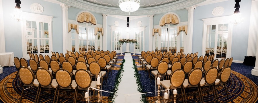 Amway Grand_Ford Ballroom_Wedding Ceremony_Aisle_Rows of Chairs_Greenery_Mirrors_Candles_Chandliers_Flowers