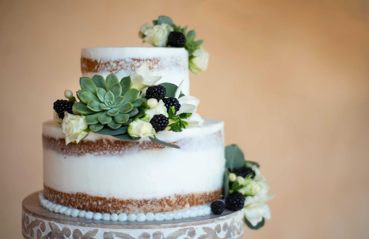 Amway Grand_Wedding Cake_Two Tiers_White Frosting_Green Flowers_White Flowers_Blackberries
