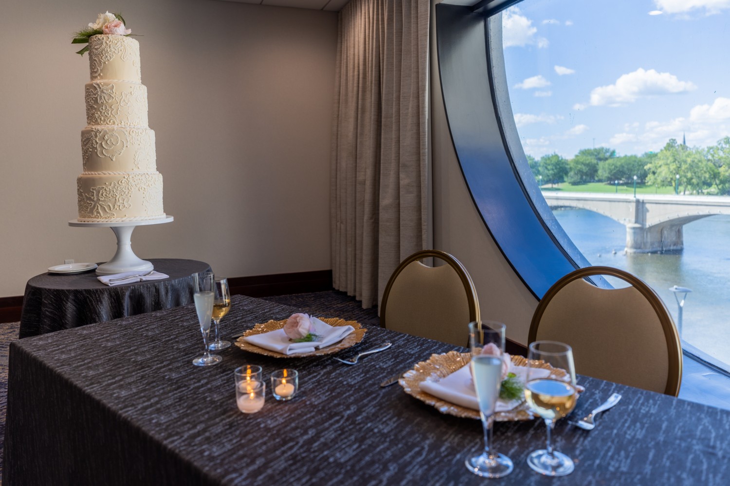 Amway Grand_Pearl Room_Wedding_Set Up_Tables_Linen_Candles_Glasses_Cake_Napkins_Silverware_Big Round Window